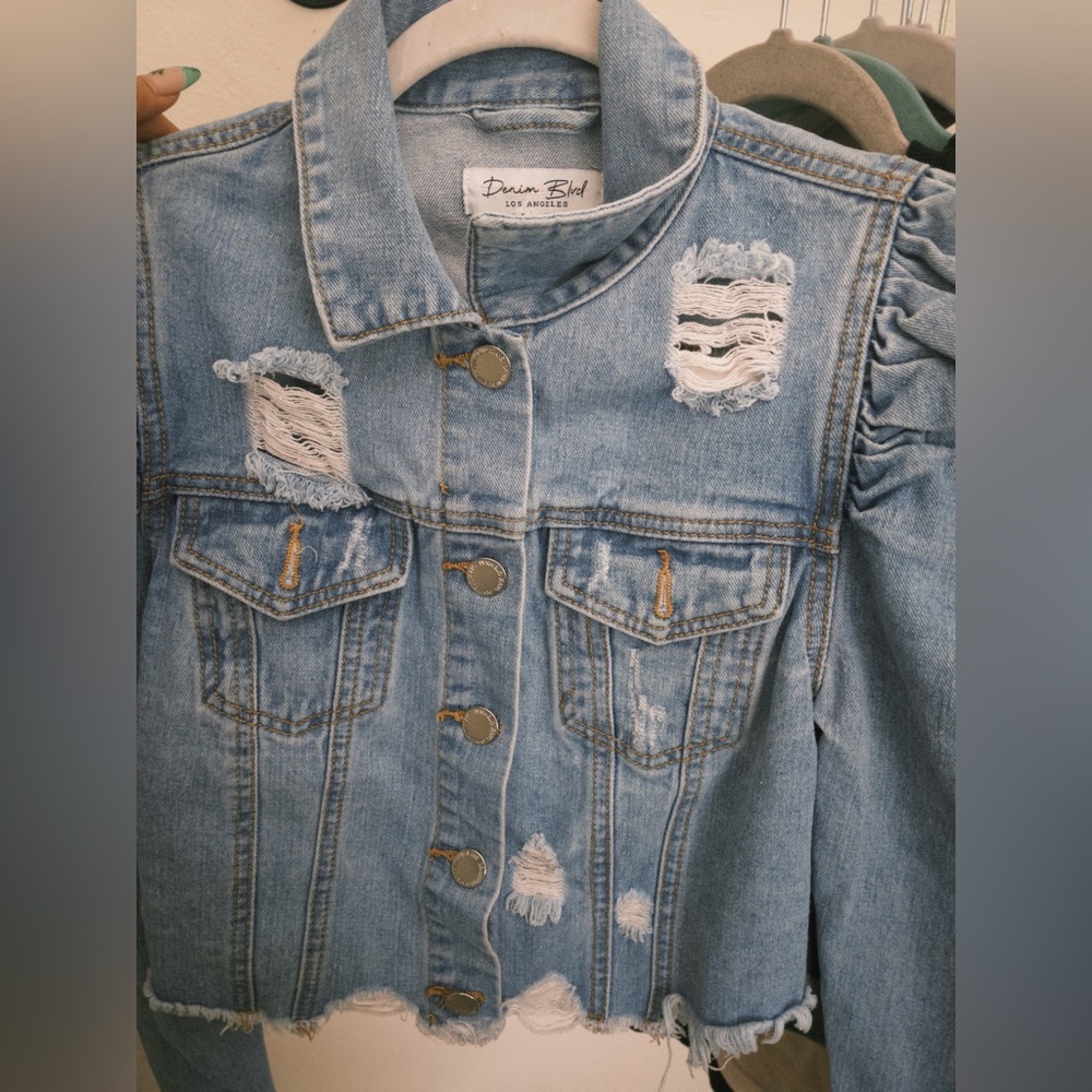 Selling a ripped denim jacket with puff sleeves!